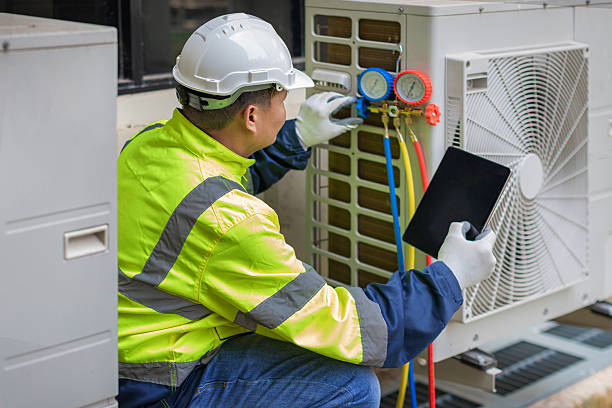 Professional Air Conditioning Repair technician working in Hamilton, MA